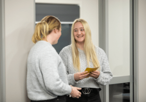 Team Leader Amber Sim talking with another staff member